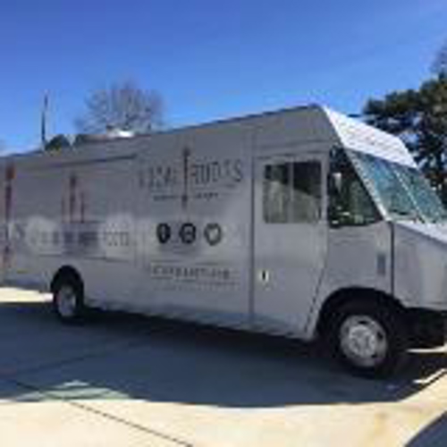White truck with custom vehicle graphics