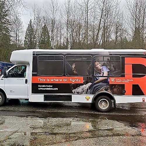 White truck with custom vehicle wrap