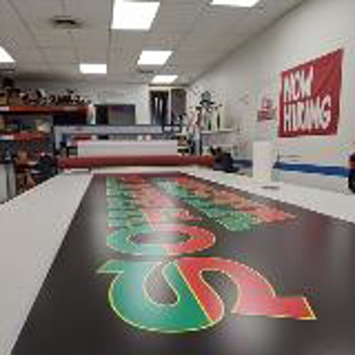 Custom banner with green and red lettering