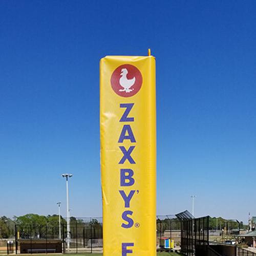Yellow Pole wrap with letters on the side of the field