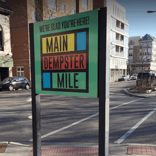 Green exterior signage of mile dempster mile on the street