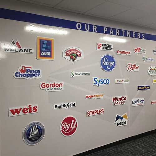 A Company partners wall logos on the office wall