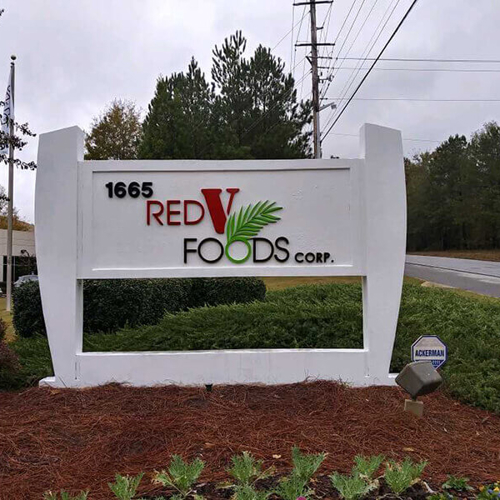 The Red V Foods corp monument signage outside the office building