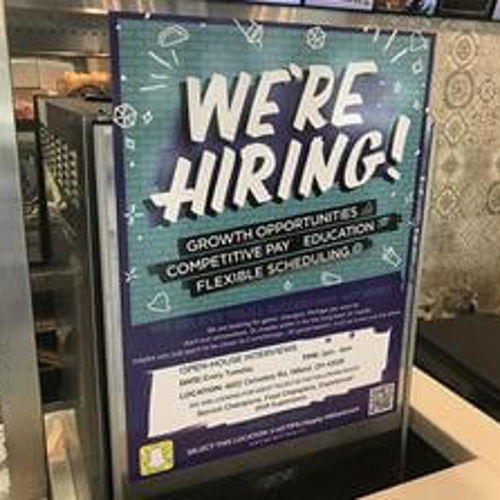 We are Hiring signage inside the store