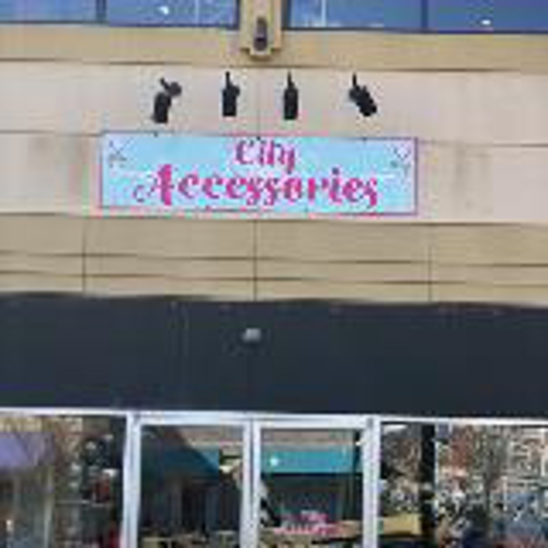 City Accessories Signage  on the store building with lights on top of the signage