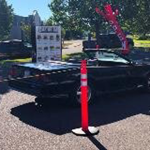 Car on the drive-thru line with menu on the side