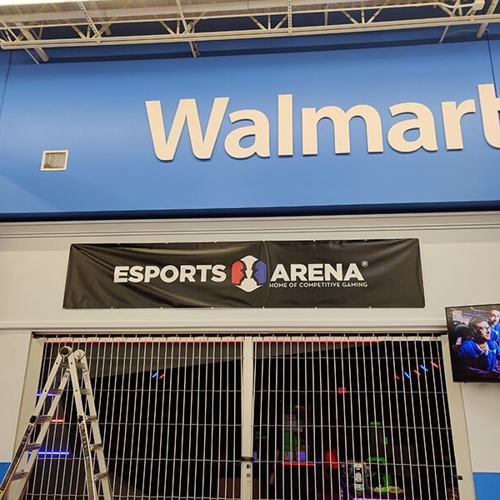 large black banner hung inside a Walmart store