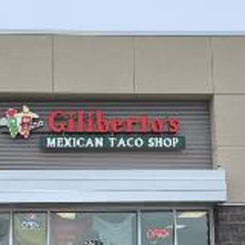 Red and green Gilberto's channel sign on the building
