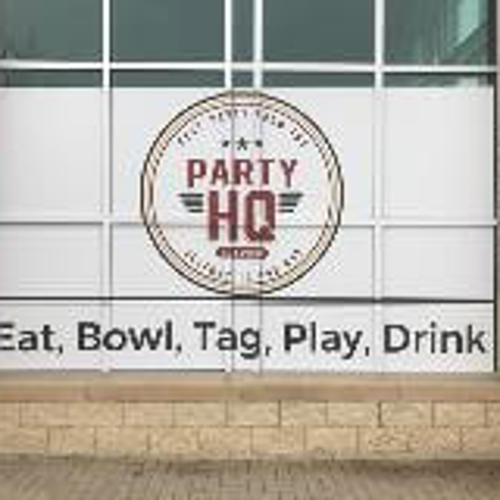 Store window with lettering  of party HQ